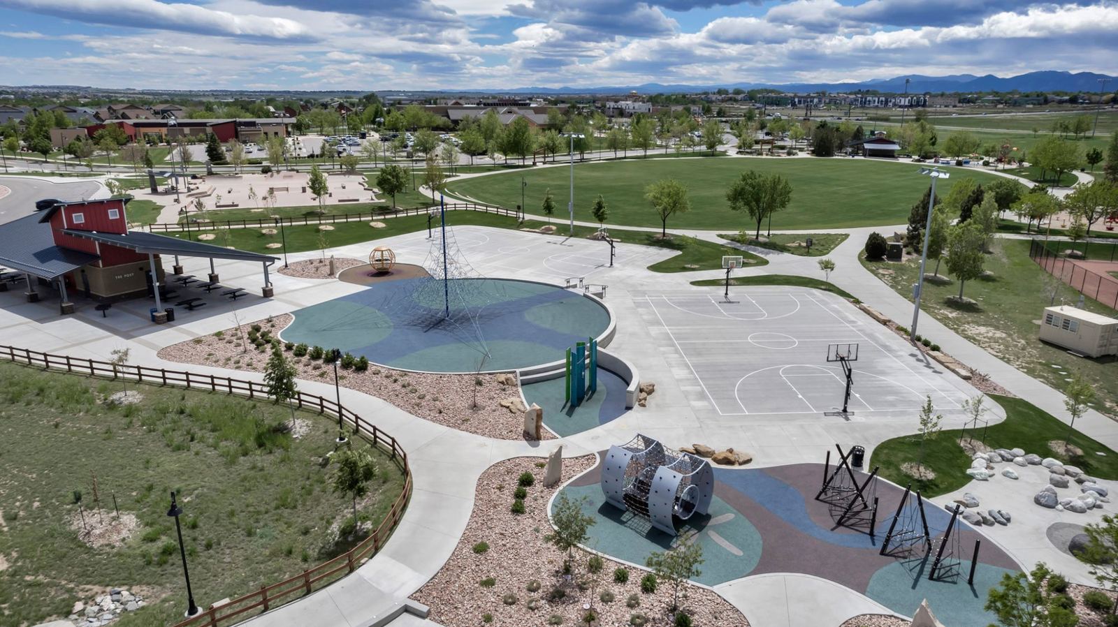 Basketball courts and climbing structures at Colliers Hill's community park